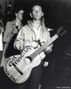 Woody-Guthrie-nylon-string-this-guitar-kills-Fascists-circa-1940.jpg
